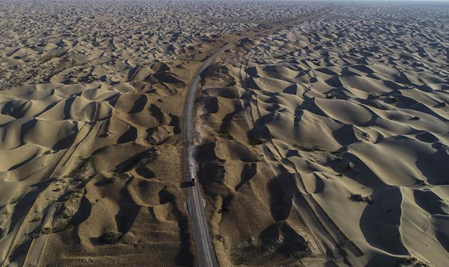 Third desert road under construction in Taklimakan desert in NW China's Xinjiang