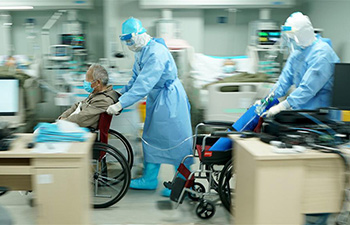 Medical workers take care of patients at Huoshenshan Hospital in Wuhan